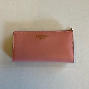Kate Spade wallet in a pink/blush leather. Classic and elegant.